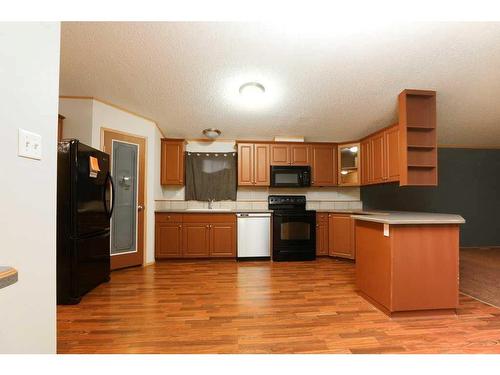 1716 18 Avenue, Coaldale, AB - Indoor Photo Showing Kitchen