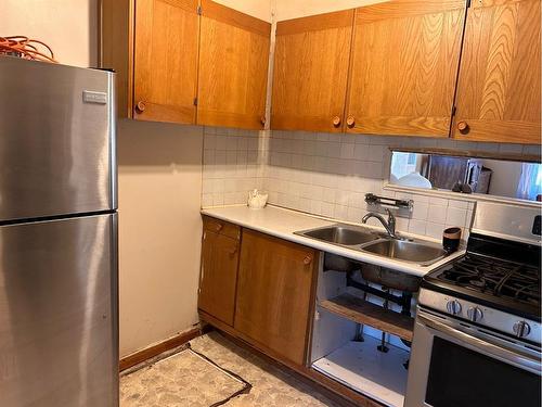 7046 18 Avenue, Coleman, AB - Indoor Photo Showing Kitchen With Double Sink