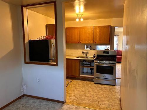 7046 18 Avenue, Coleman, AB - Indoor Photo Showing Kitchen With Double Sink