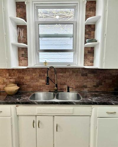 6730 17Th Avenue, Coleman, AB - Indoor Photo Showing Kitchen With Double Sink