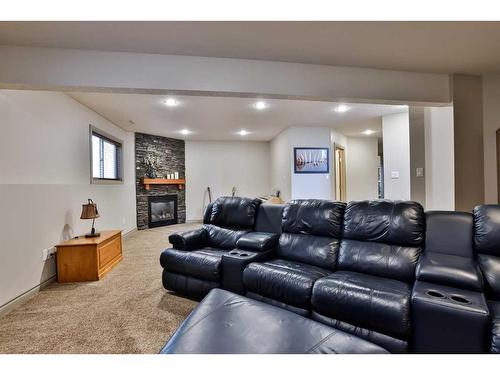 5205 44A Street, Taber, AB - Indoor Photo Showing Living Room With Fireplace