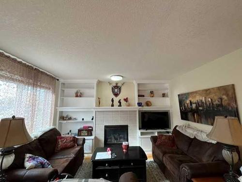 34 Fairway Village, Taber, AB - Indoor Photo Showing Living Room With Fireplace