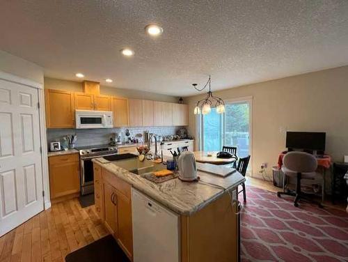 34 Fairway Village, Taber, AB - Indoor Photo Showing Kitchen With Double Sink