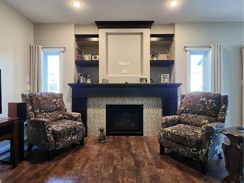 709 Twinriver Loop West, Lethbridge, AB - Indoor Photo Showing Living Room With Fireplace