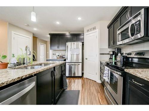 99 Mt Sundial Court West, Lethbridge, AB - Indoor Photo Showing Kitchen With Double Sink With Upgraded Kitchen