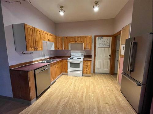 325S 100 West, Raymond, AB - Indoor Photo Showing Kitchen With Double Sink