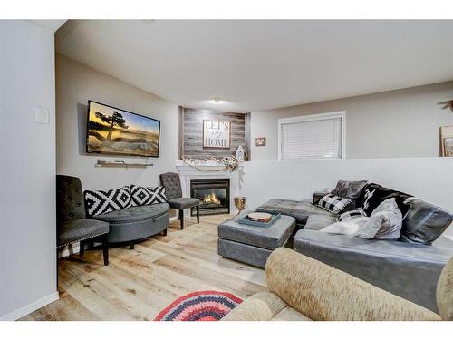 1004 24 Avenue, Coaldale, AB - Indoor Photo Showing Living Room With Fireplace