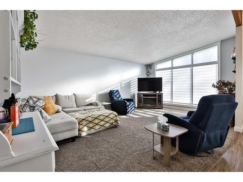 5608 55 Street, Taber, AB - Indoor Photo Showing Living Room With Fireplace