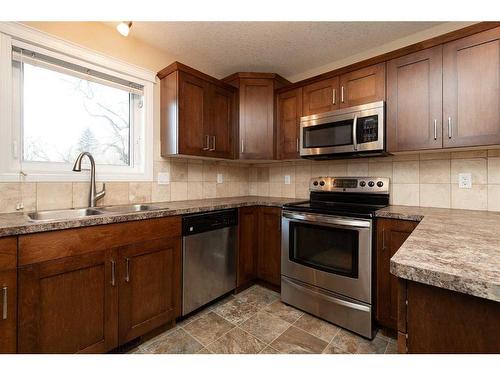 1116 13 Street South, Lethbridge, AB - Indoor Photo Showing Kitchen With Double Sink