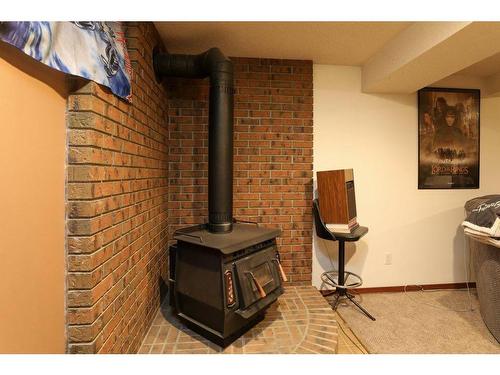 2022 23Rd Avenue North, Lethbridge, AB - Indoor Photo Showing Other Room With Fireplace