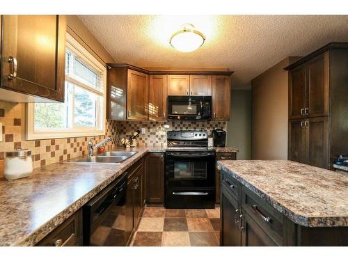 2022 23Rd Avenue North, Lethbridge, AB - Indoor Photo Showing Kitchen With Double Sink