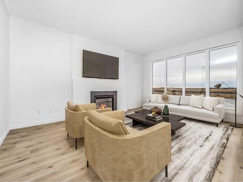 529 Malahat Green West, Lethbridge, AB - Indoor Photo Showing Living Room With Fireplace