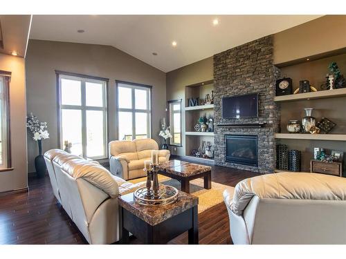 14 Countrylane Blvd, Rural Taber, M.D. Of, AB - Indoor Photo Showing Living Room With Fireplace