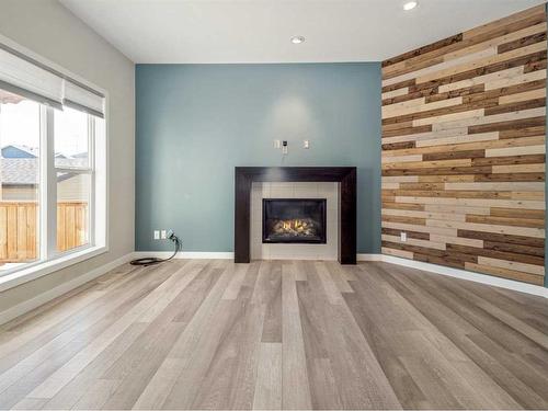 923 Maydell Palmer Vista North, Lethbridge, AB - Indoor Photo Showing Living Room With Fireplace