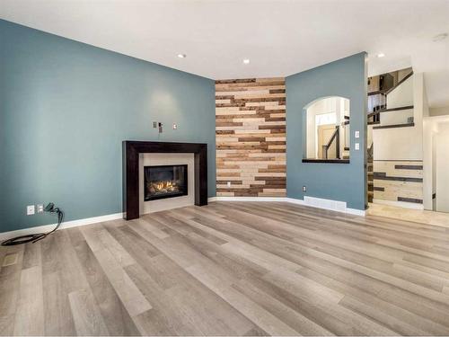 923 Maydell Palmer Vista North, Lethbridge, AB - Indoor Photo Showing Living Room With Fireplace