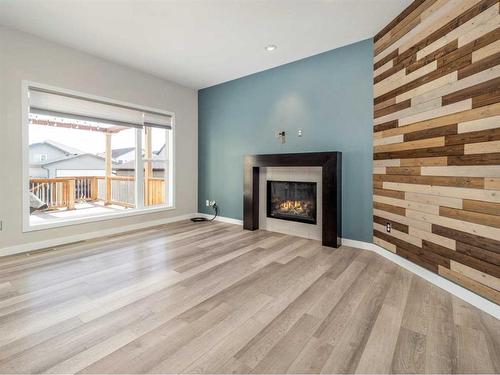 923 Maydell Palmer Vista North, Lethbridge, AB - Indoor Photo Showing Living Room With Fireplace