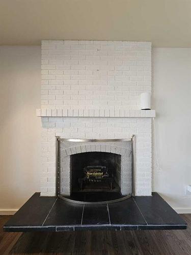 1138 Great Lakes Road South, Lethbridge, AB - Indoor Photo Showing Living Room With Fireplace