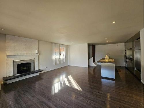 1138 Great Lakes Road South, Lethbridge, AB - Indoor Photo Showing Living Room With Fireplace