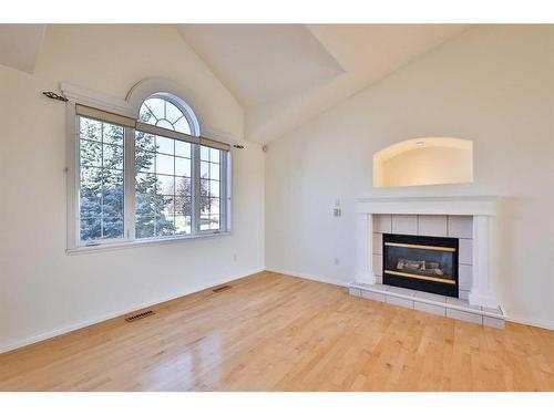 84 Canyon Boulevard West, Lethbridge, AB - Indoor Photo Showing Living Room With Fireplace