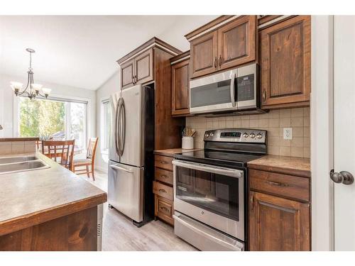 402 10A Street, Nobleford, AB - Indoor Photo Showing Kitchen With Double Sink