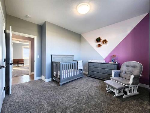 37 Quarry Bank Road, Raymond, AB - Indoor Photo Showing Bedroom