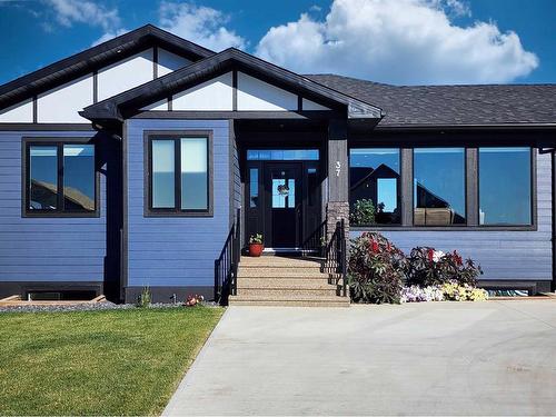 37 Quarry Bank Road, Raymond, AB - Outdoor With Facade