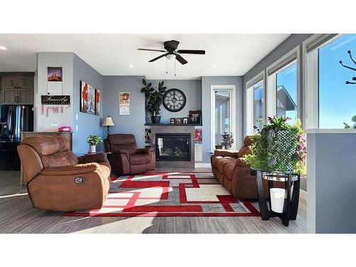 37 Quarry Bank Road, Raymond, AB - Indoor Photo Showing Living Room With Fireplace