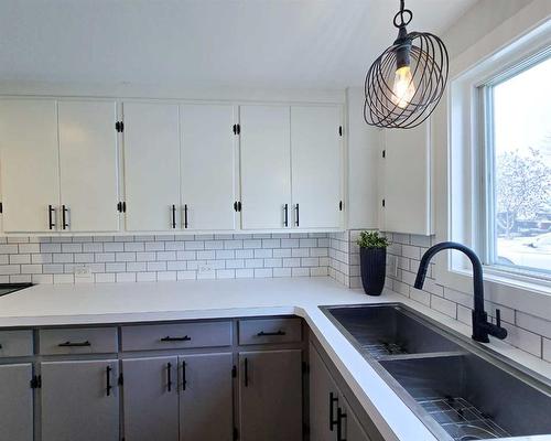 215 Dufferin Street, Granum, AB - Indoor Photo Showing Kitchen With Double Sink