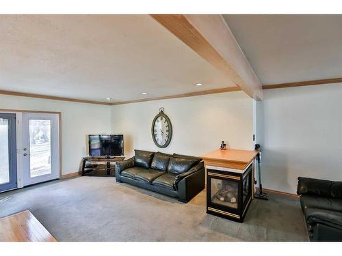 44 E 100 S, Raymond, AB - Indoor Photo Showing Living Room With Fireplace