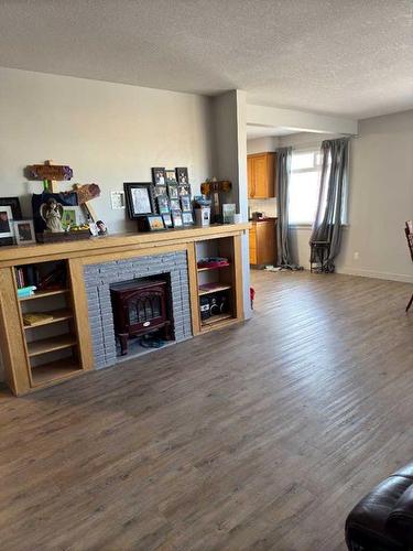 1314 5A Avenue North, Lethbridge, AB - Indoor Photo Showing Other Room With Fireplace