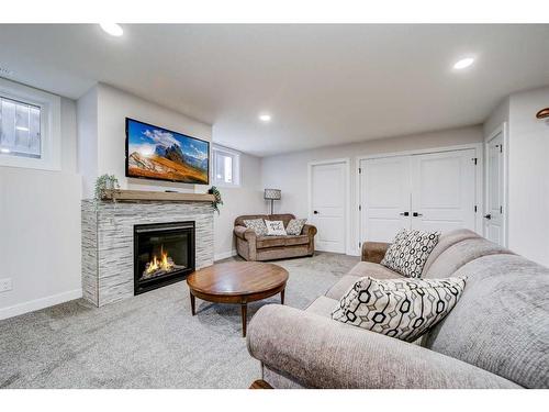 2018 30A Avenue, Coaldale, AB - Indoor Photo Showing Living Room With Fireplace