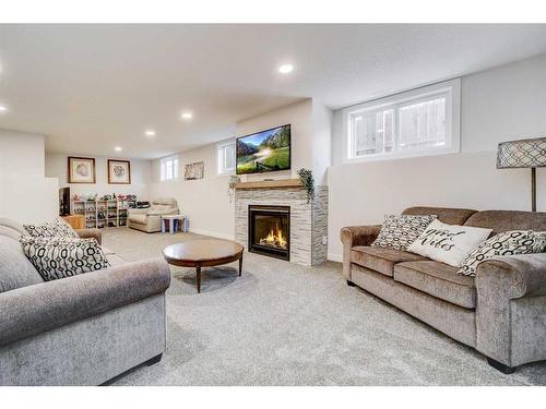 2018 30A Avenue, Coaldale, AB - Indoor Photo Showing Living Room With Fireplace