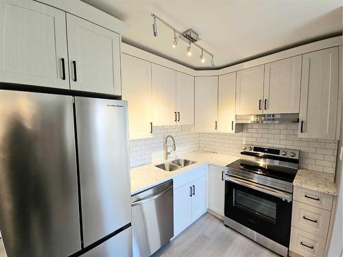 611 17 Street South, Lethbridge, AB - Indoor Photo Showing Kitchen With Stainless Steel Kitchen With Double Sink