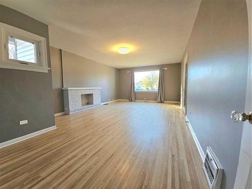 611 17 Street South, Lethbridge, AB - Indoor Photo Showing Other Room With Fireplace