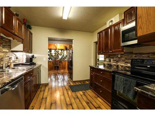 5015 52 Street, Taber, AB - Indoor Photo Showing Kitchen With Double Sink