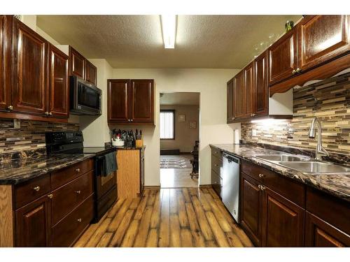 5015 52 Street, Taber, AB - Indoor Photo Showing Kitchen With Double Sink