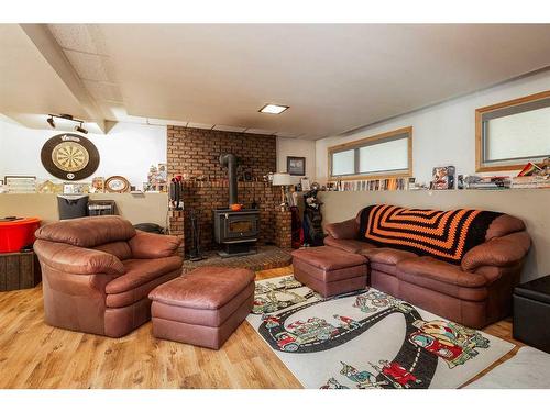 1602 20 Avenue North, Lethbridge, AB - Indoor Photo Showing Living Room With Fireplace