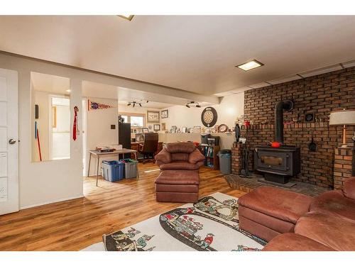 1602 20 Avenue North, Lethbridge, AB - Indoor Photo Showing Living Room With Fireplace