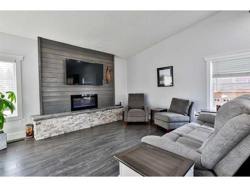 1193 Scenic Drive South, Lethbridge, AB - Indoor Photo Showing Living Room With Fireplace