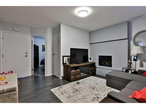 1193 Scenic Drive South, Lethbridge, AB - Indoor Photo Showing Living Room With Fireplace