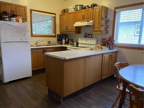 1221 84 Street, Coleman, AB - Indoor Photo Showing Kitchen With Double Sink