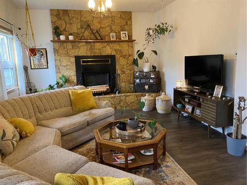 1221 84 Street, Coleman, AB - Indoor Photo Showing Living Room With Fireplace