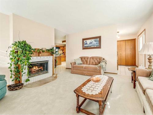 5810 46 Street, Taber, AB - Indoor Photo Showing Living Room With Fireplace