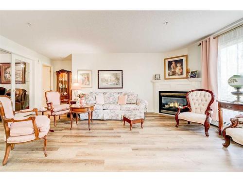 323-100 2 Avenue South, Lethbridge, AB - Indoor Photo Showing Living Room With Fireplace