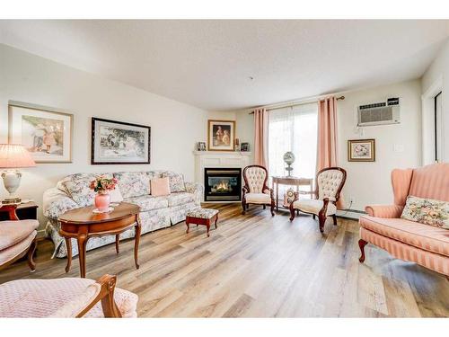 323-100 2 Avenue South, Lethbridge, AB - Indoor Photo Showing Living Room With Fireplace