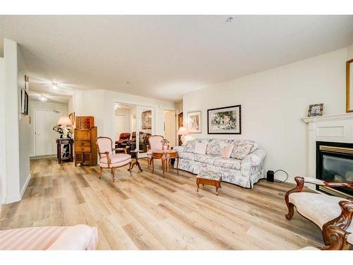 323-100 2 Avenue South, Lethbridge, AB - Indoor Photo Showing Living Room With Fireplace