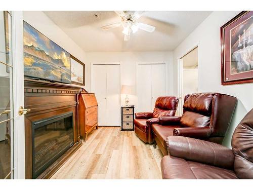 323-100 2 Avenue South, Lethbridge, AB - Indoor Photo Showing Living Room With Fireplace