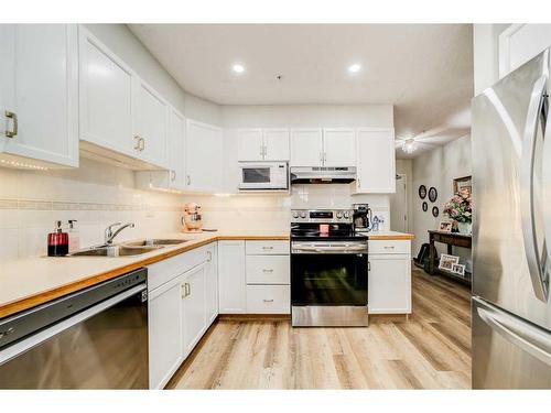 323-100 2 Avenue South, Lethbridge, AB - Indoor Photo Showing Kitchen With Double Sink