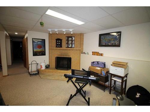 2107 10 Street, Coaldale, AB - Indoor With Fireplace