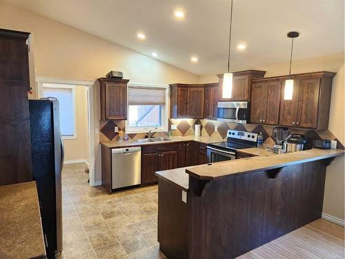 502 Centennial Avenue, Nobleford, AB - Indoor Photo Showing Kitchen With Double Sink